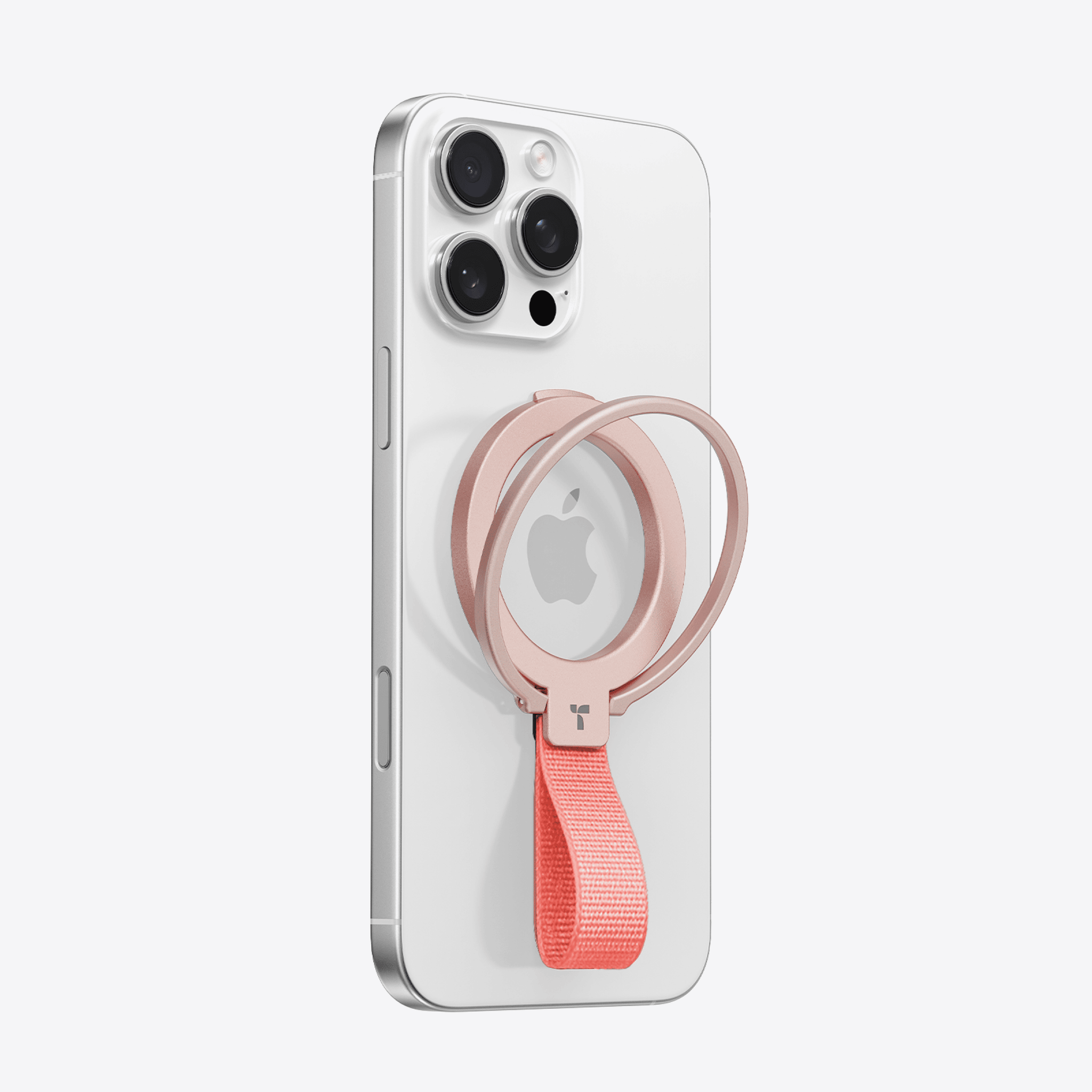 オムニリング ローズゴールド スマートフォンリング、コーラルストラップ付き、ホワイトiPhoneに装着。